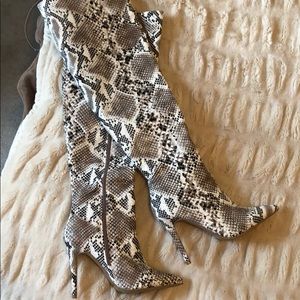 Snake skinned knee high boots